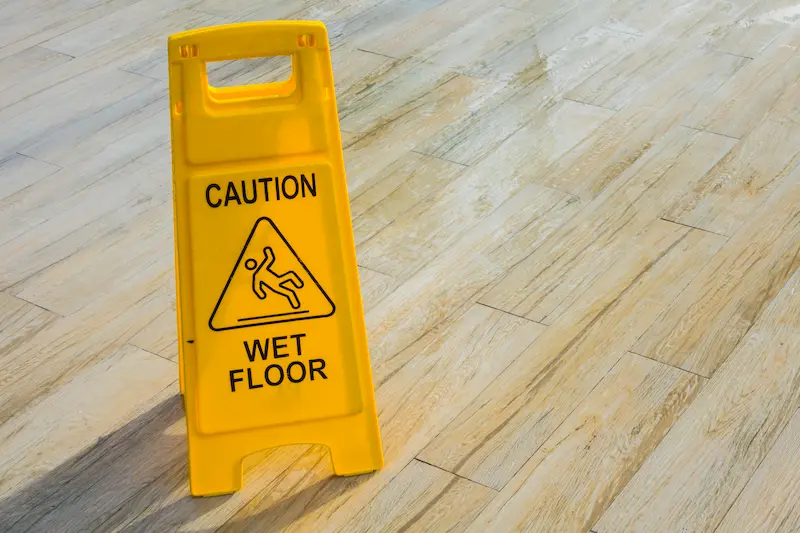 Caution wet floor sign on a wet floor