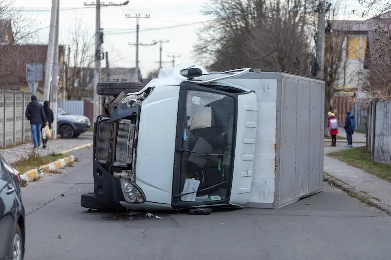 Riverview truck accident lawyers investigate truck turned on its side in the street after truck accident in Riverview, Florida.