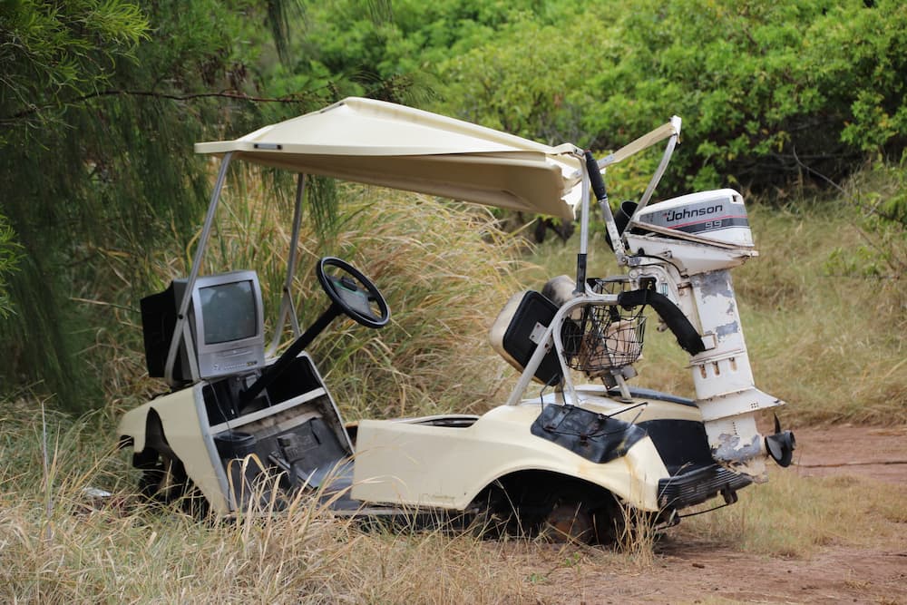 golf cart accident lawyer investigates damaged cart