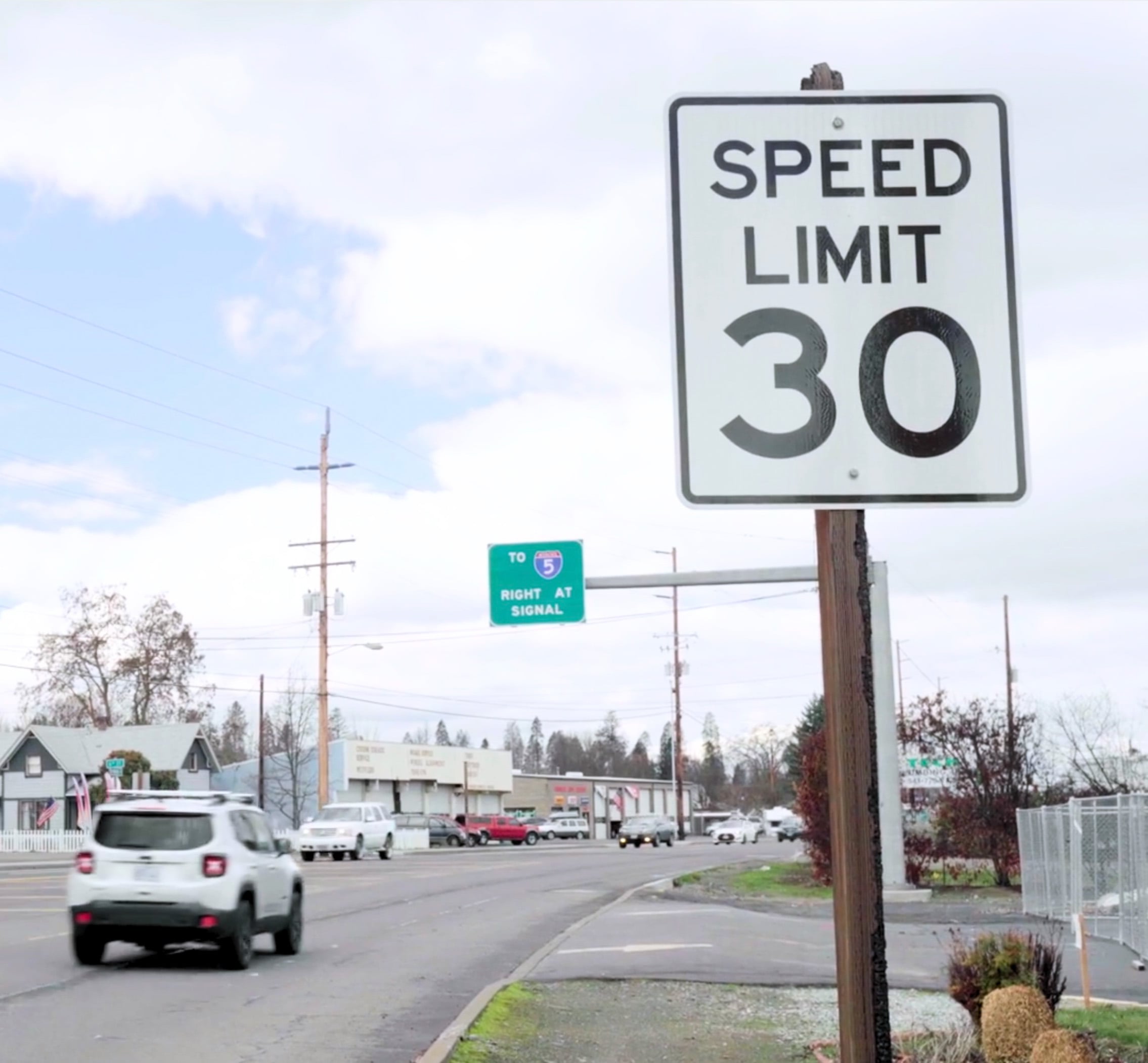 a speed limit sign in a business district